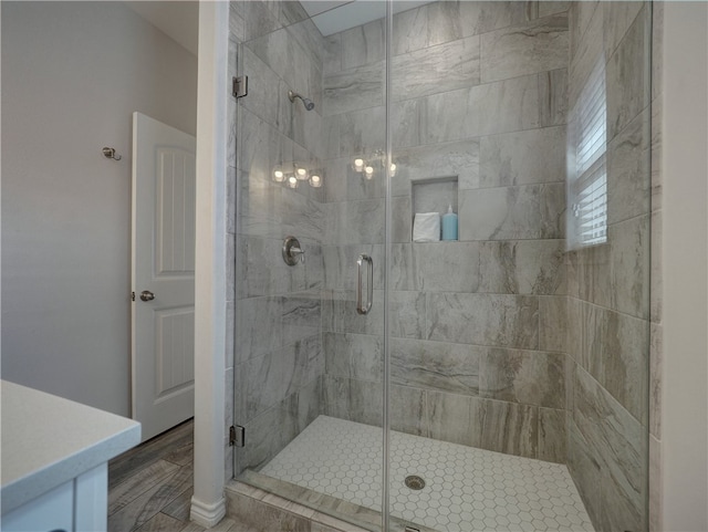 bathroom with a shower with door