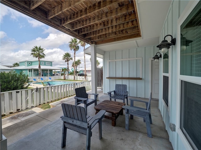 view of patio / terrace with a fenced in pool