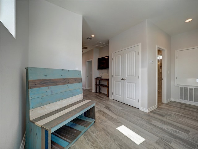 hallway with light wood-type flooring