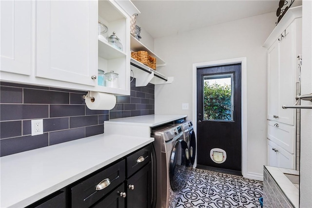 15342 Cartagena Ct, Corpus Christi, TX 78418 - washroom featuring washer and dryer, cabinet space, baseboards, and light tile patterned floors