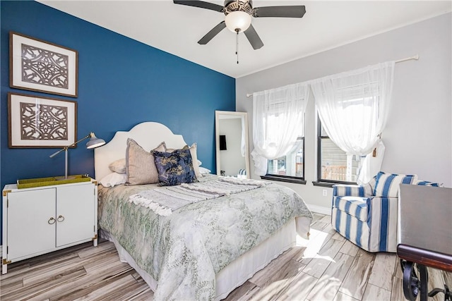 15342 Cartagena Ct, Corpus Christi, TX 78418 - bedroom with light wood-style floors, ceiling fan, and baseboards