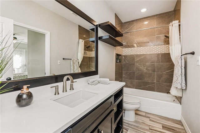15342 Cartagena Ct, Corpus Christi, TX 78418 - bathroom with toilet, vanity, shower / bath combo, wood finished floors, and ceiling fan