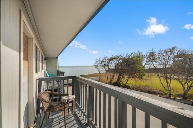 balcony featuring a water view