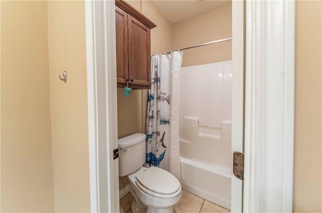 bathroom with tile patterned floors, toilet, and shower / bath combo