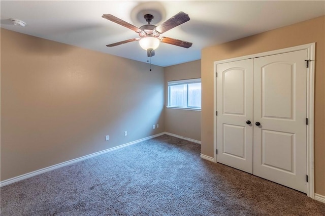 unfurnished bedroom featuring carpet flooring, ceiling fan, and a closet