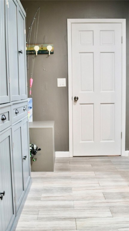 bathroom with hardwood / wood-style floors