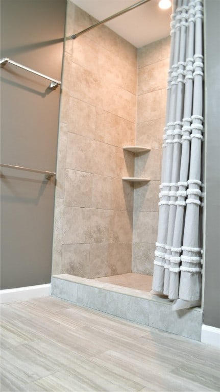 bathroom with wood-type flooring