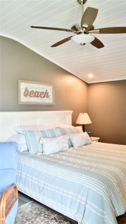 bedroom with lofted ceiling, wood-type flooring, and ceiling fan