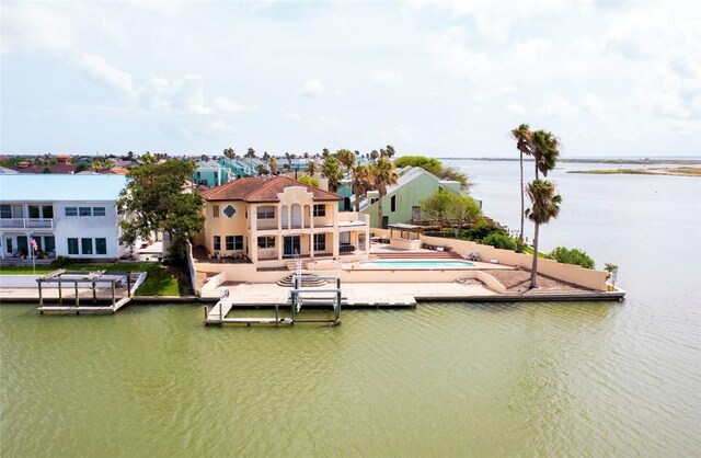 13702 Suntan Ave, Corpus Christi, TX 78418 - dock area featuring a water view, a patio, and a swimming pool