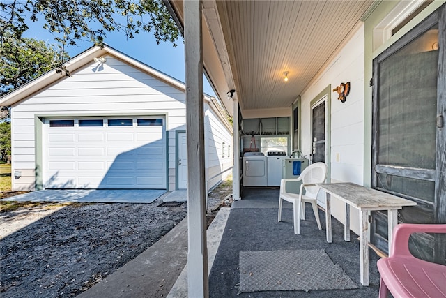 exterior space featuring washing machine and dryer and a garage