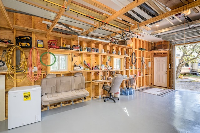 garage featuring white fridge