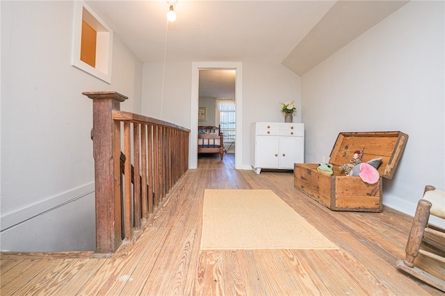 living area with hardwood / wood-style flooring