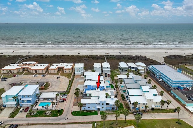 birds eye view of property featuring a water view and a view of the beach