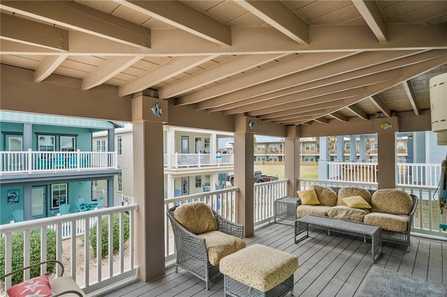 sunroom featuring beamed ceiling and wood ceiling