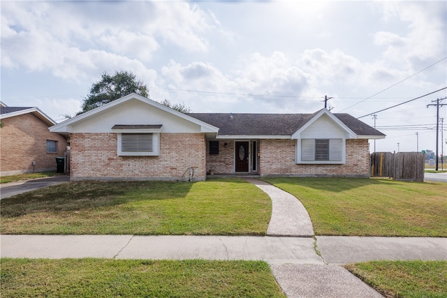 ranch-style home featuring a front lawn