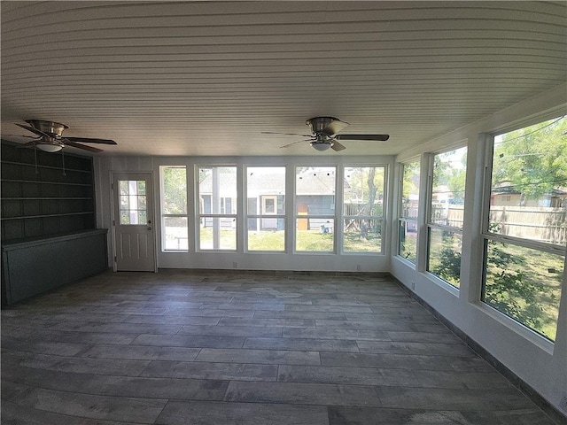 615 E Henderson St, Bishop, TX 78343 - unfurnished sunroom featuring wooden ceiling, a healthy amount of sunlight, and a deck