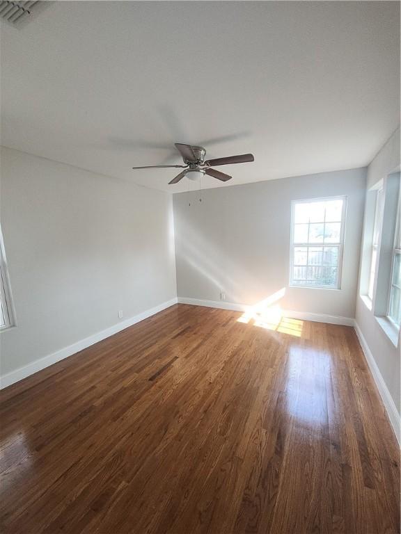 615 E Henderson St, Bishop, TX 78343 - spare room with baseboards, ceiling fan, and wood finished floors