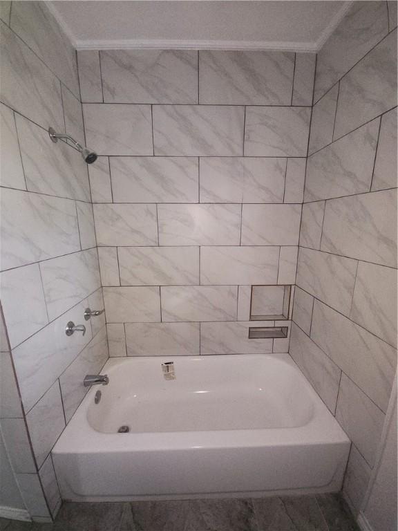 615 E Henderson St, Bishop, TX 78343 - full bathroom featuring crown molding and bathing tub / shower combination