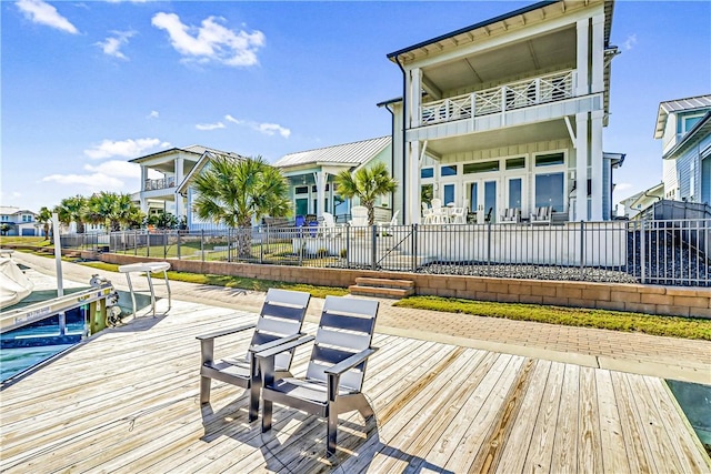 back of house featuring a balcony