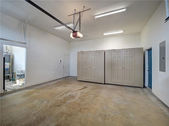 garage with a garage door opener, water heater, and electric panel