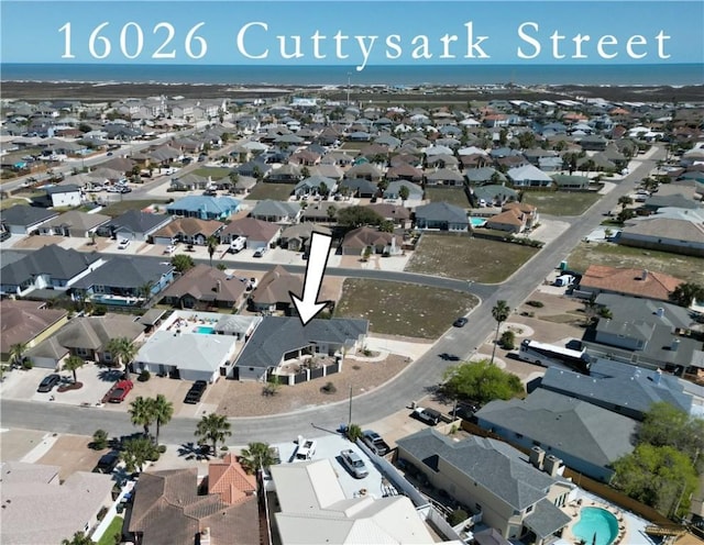aerial view of property and surrounding area with nearby suburban area