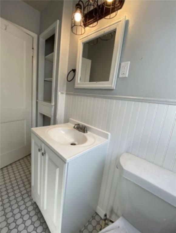 bathroom with vanity and toilet