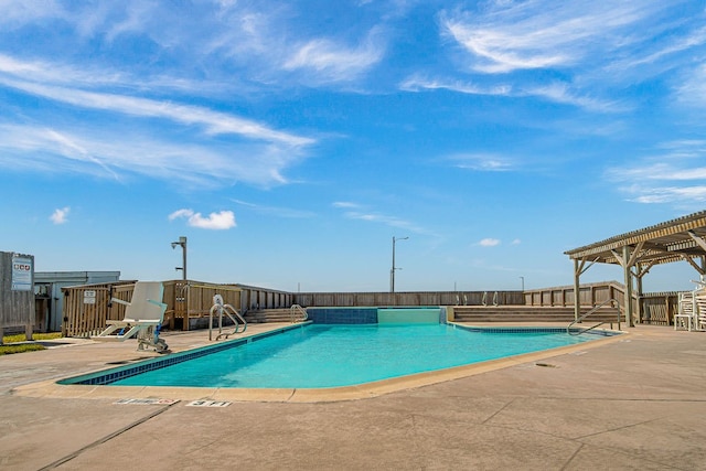 view of swimming pool with a pergola and a patio