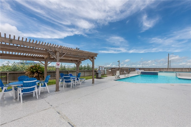 view of swimming pool with a patio area and a pergola