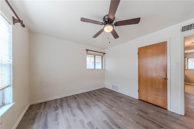 5813 Academy Dr, Corpus Christi, TX 78407 - unfurnished bedroom featuring wood finished floors, baseboards, and a ceiling fan