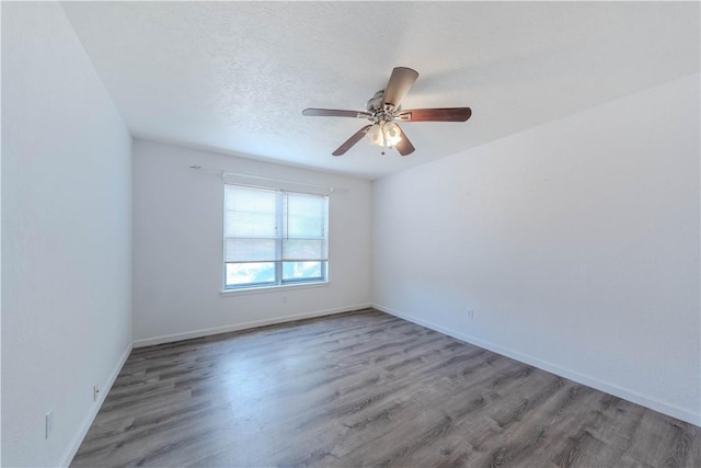 5813 Academy Dr, Corpus Christi, TX 78407 - empty room with wood finished floors, baseboards, and a ceiling fan