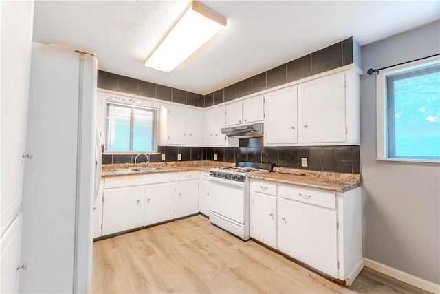 5813 Academy Dr, Corpus Christi, TX 78407 - kitchen with white appliances, under cabinet range hood, a sink, and white cabinetry