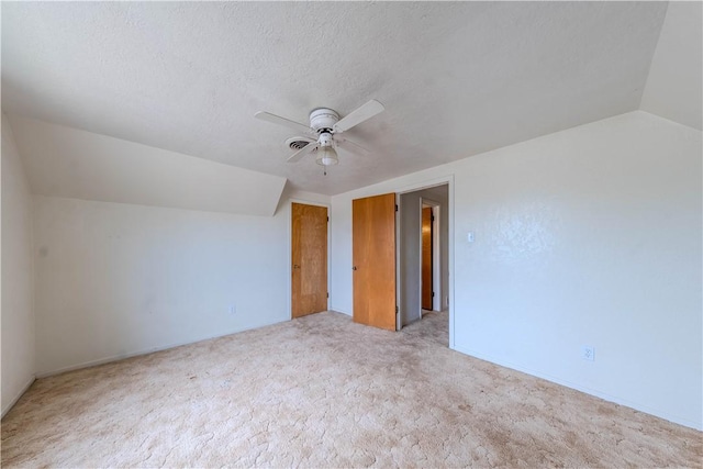 5813 Academy Dr, Corpus Christi, TX 78407 - additional living space featuring a ceiling fan, light colored carpet, lofted ceiling, and a textured ceiling