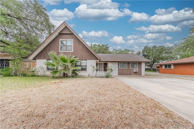 5813 Academy Dr, Corpus Christi, TX 78407 - view of front of home with concrete driveway, cooling unit, and brick siding