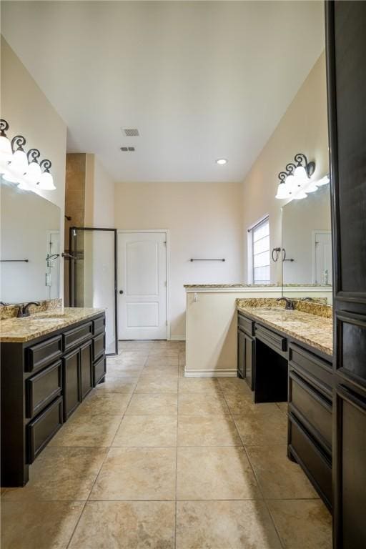 6725 Brooke Rd, Corpus Christi, TX 78414 - full bath with two vanities and tile patterned flooring