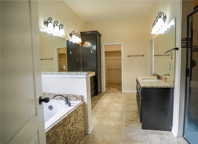 6725 Brooke Rd, Corpus Christi, TX 78414 - full bathroom with a bath, vanity, tile patterned floors, a spacious closet, and a tile shower