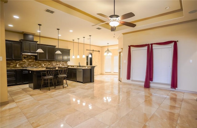 6725 Brooke Rd, Corpus Christi, TX 78414 - kitchen with stainless steel dishwasher, ornamental molding, a center island, tasteful backsplash, and ceiling fan