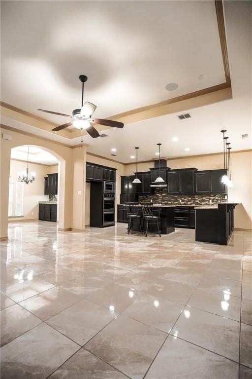 6725 Brooke Rd, Corpus Christi, TX 78414 - living area with a ceiling fan and arched walkways