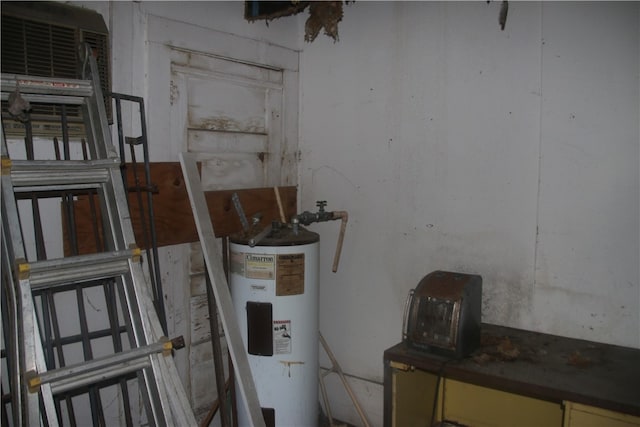 utility room featuring water heater