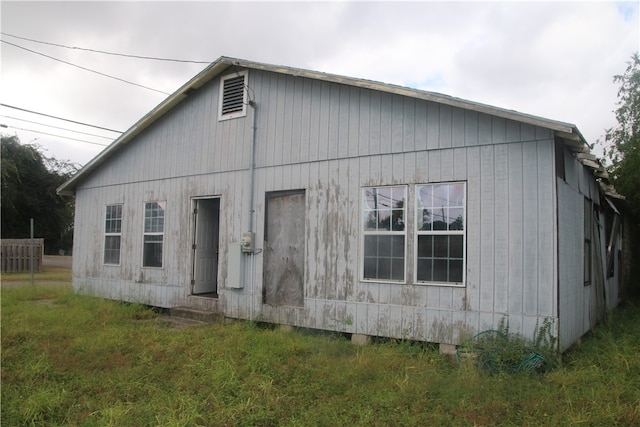 view of property exterior with a yard