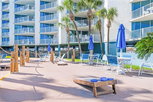 surrounding community featuring a patio area and fence