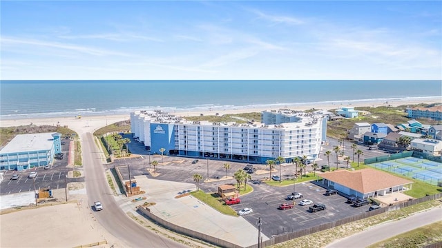 birds eye view of property with a beach view and a water view