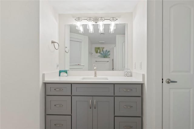 bathroom featuring a closet and vanity