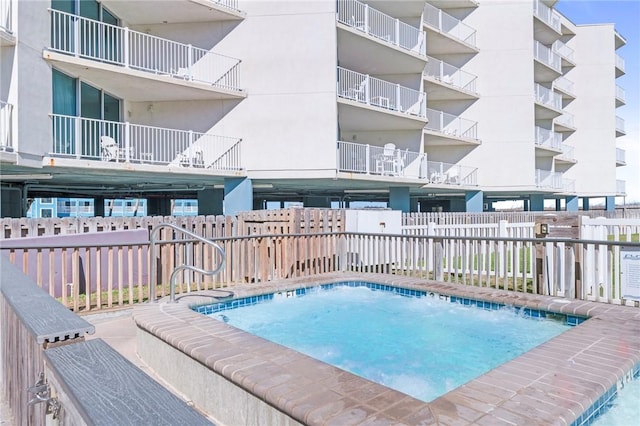 view of pool with fence