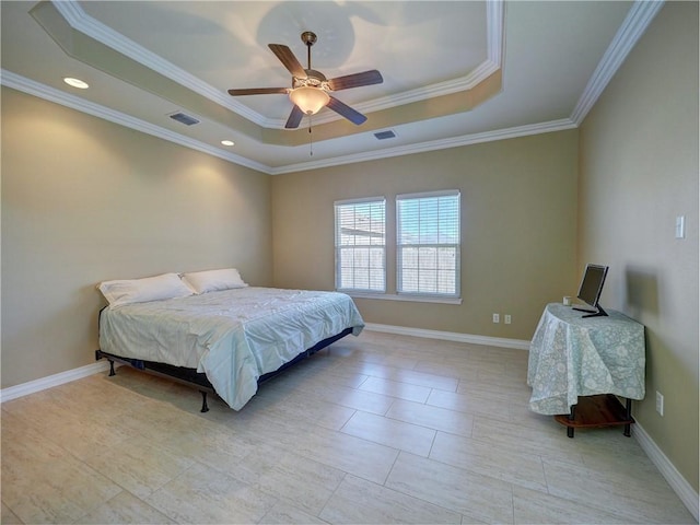 bedroom with a tray ceiling, ceiling fan, and crown molding