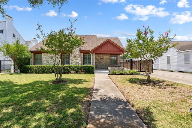 524 Del Mar, Corpus Christi, TX 78404 - view of front of house with stone siding, a gate, and roof with shingles