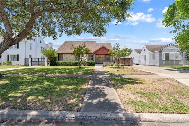 524 Del Mar, Corpus Christi, TX 78404 - view of front of home featuring a gate and stone siding