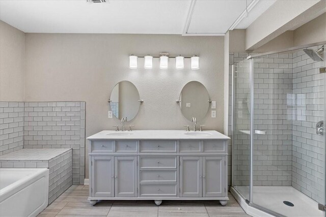 524 Del Mar, Corpus Christi, TX 78404 - bathroom with a stall shower, double vanity, and a garden tub