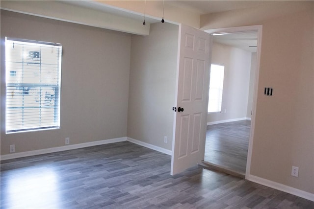 spare room featuring dark hardwood / wood-style flooring