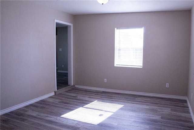 unfurnished room featuring dark hardwood / wood-style floors