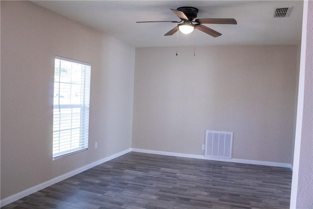 unfurnished room with dark wood-type flooring, a wealth of natural light, and ceiling fan